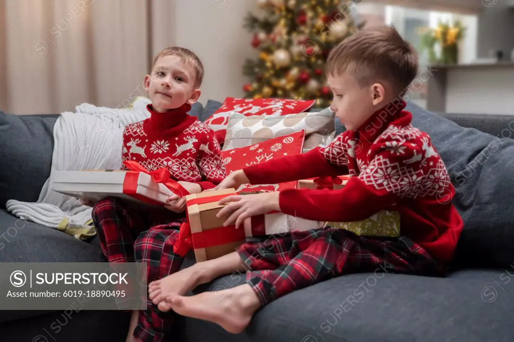children looking at christmas presents