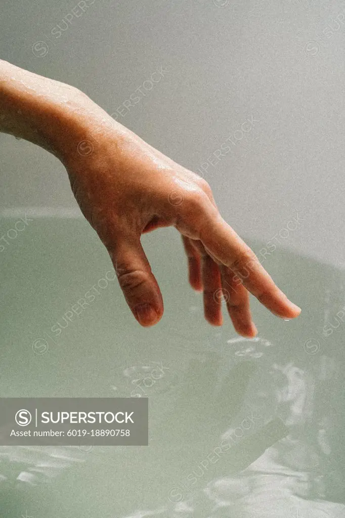 beautiful hand with a drop of water
