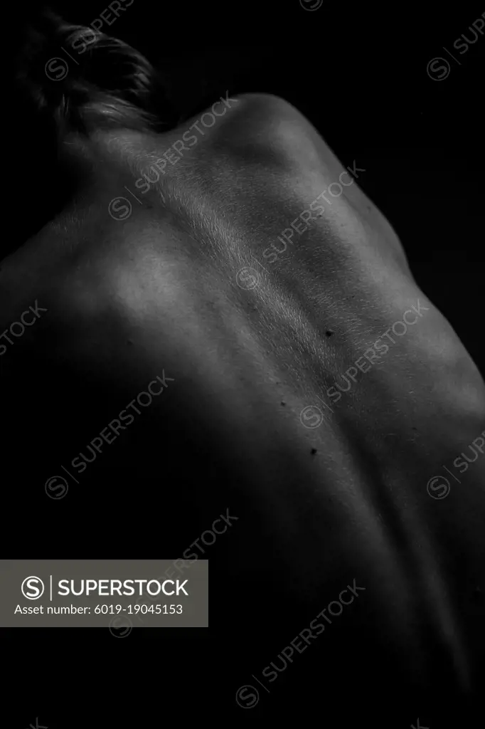 Black and white photo of body parts,yoga poses of a naked female body