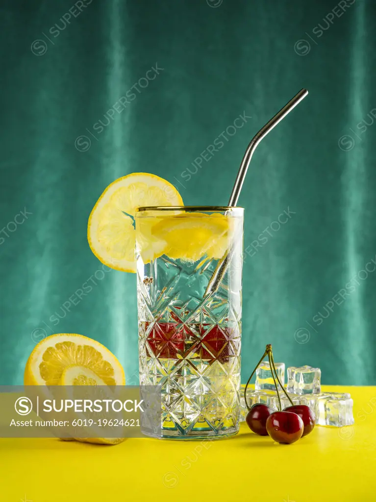 A glass of Lemonade with straw