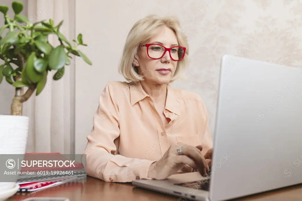 Portrait of a mature businesswoman with glasses.