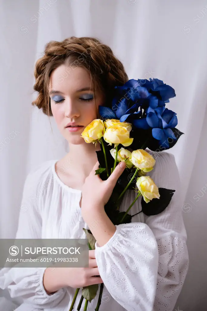 Young Ukrainian woman with a flower