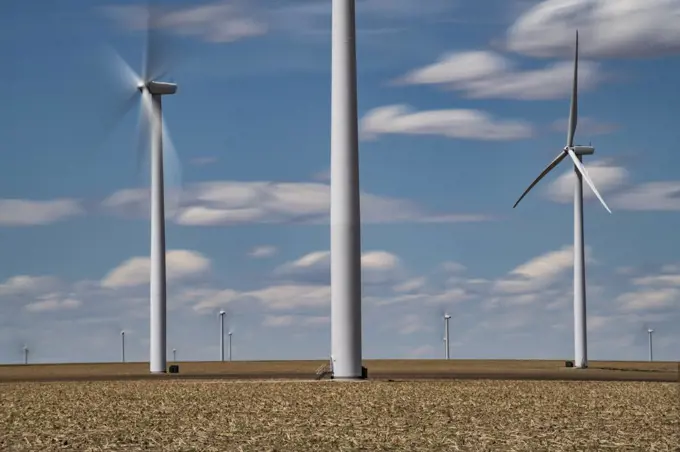 Windmills Dot the Colorado Plains Under Dramatic Skies