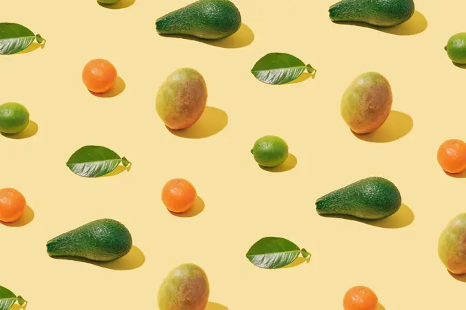 Background pattern with fresh fruit and green leaf layout on pas