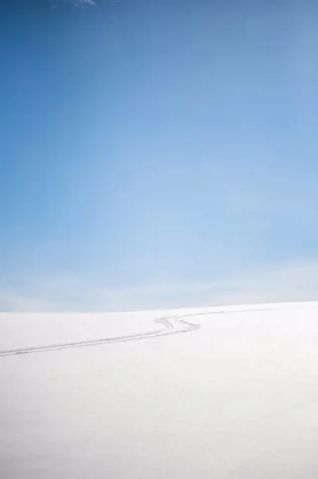 A ski track in the snow