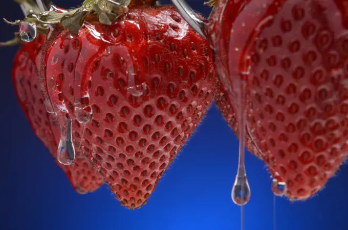 Strawberries dripping with sugary syrup