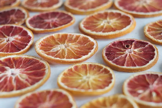 Dried orange slices lie on a table.