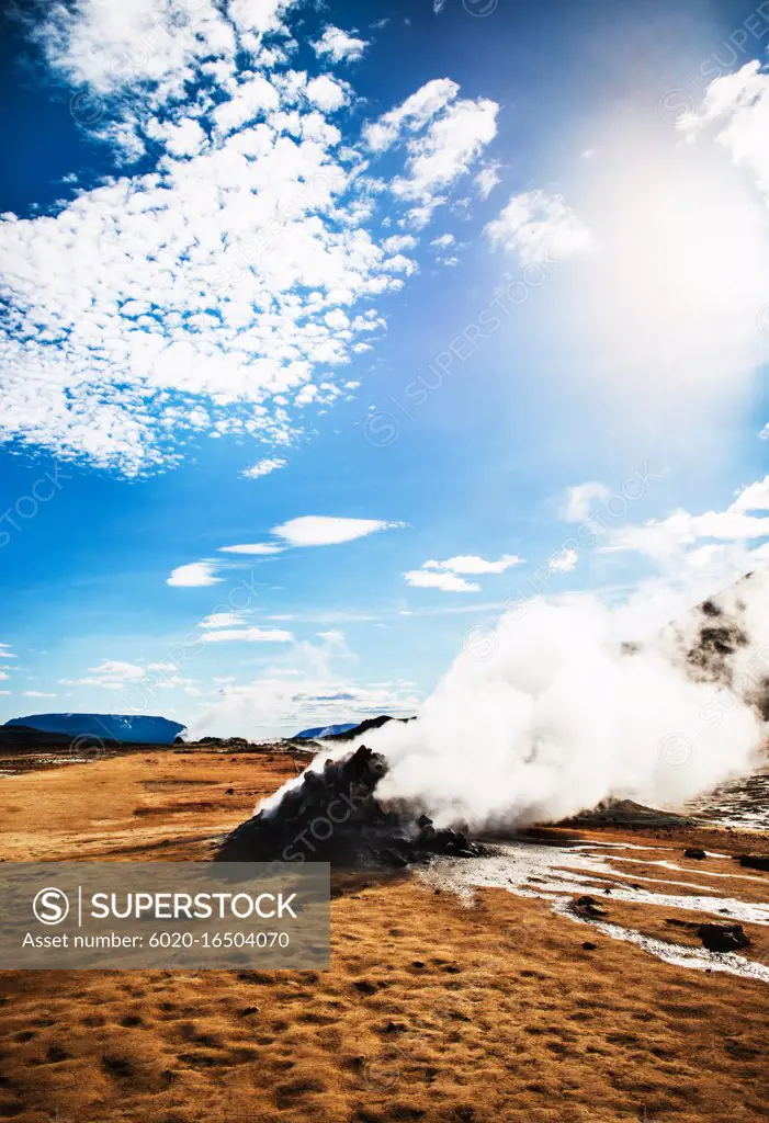 Geyser in Hverir, a geothermal area known for its bubbling pools of mud & steaming fumaroles emitting sulfuric gas, Namafjall, Iceland