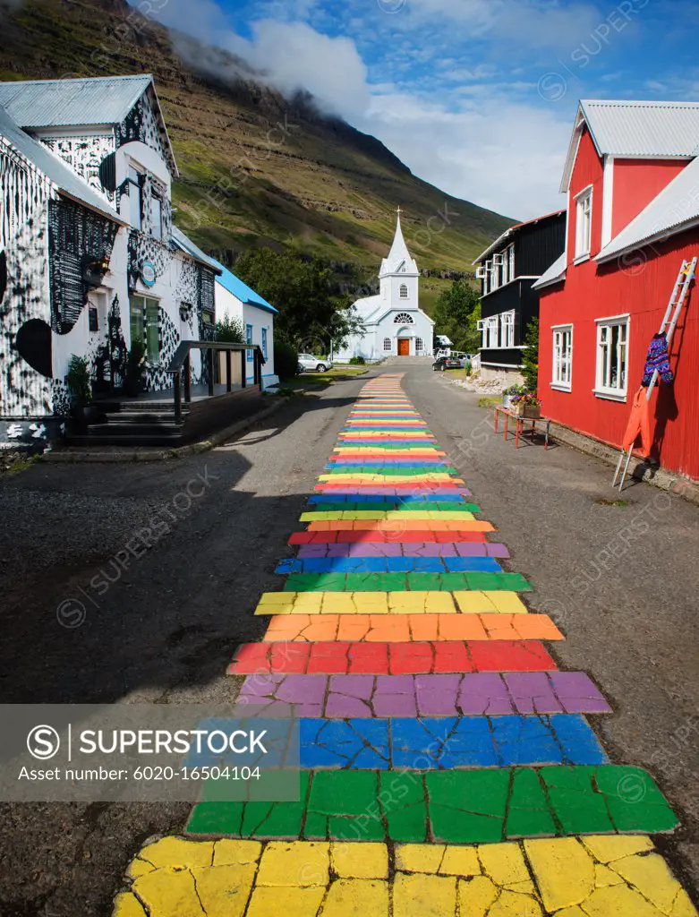 Rainbow pathway through the village of Seydisfjordur, seyðisfjörður, Iceland, Scandinavia, Europe