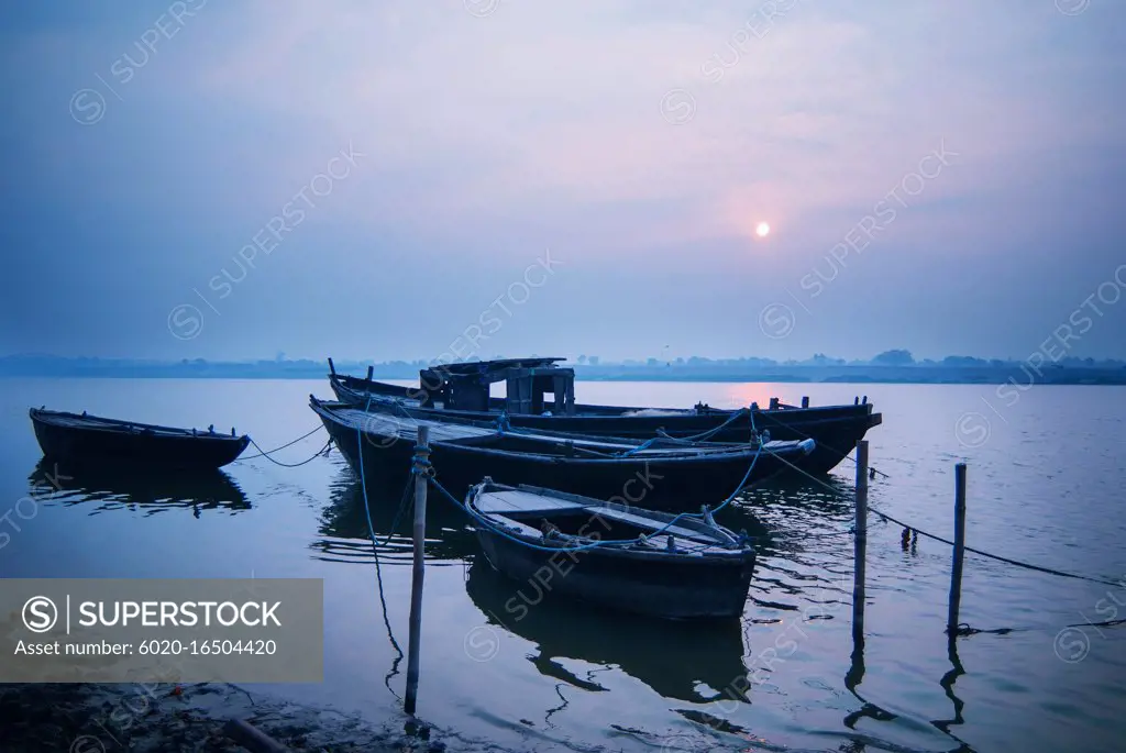 Boats in the Ganges River at sunset, Varanasi, India