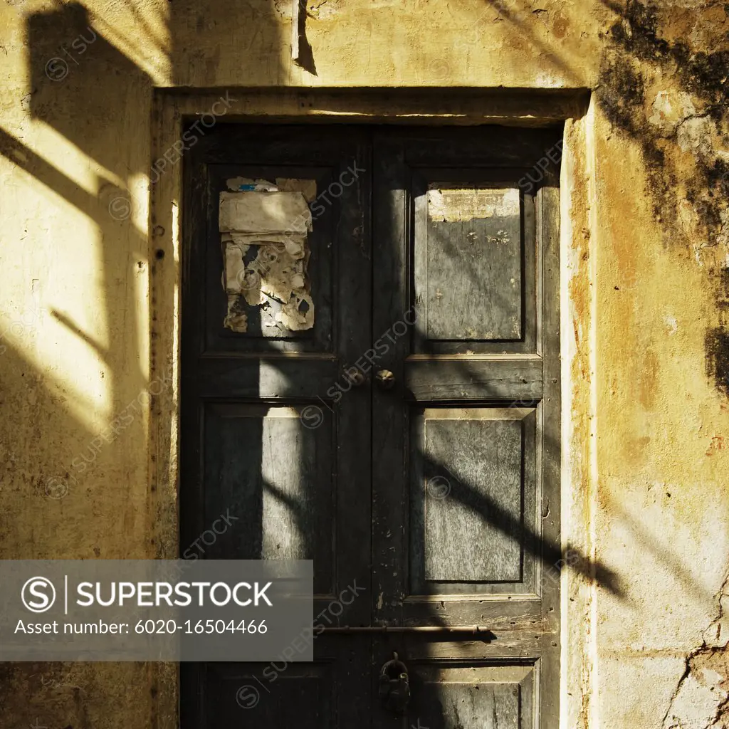 Old door and building on the streets of Jaipur, India