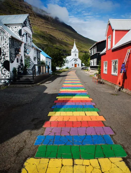 Rainbow pathway through the village of Seydisfjordur, seyðisfjörður, Iceland, Scandinavia, Europe