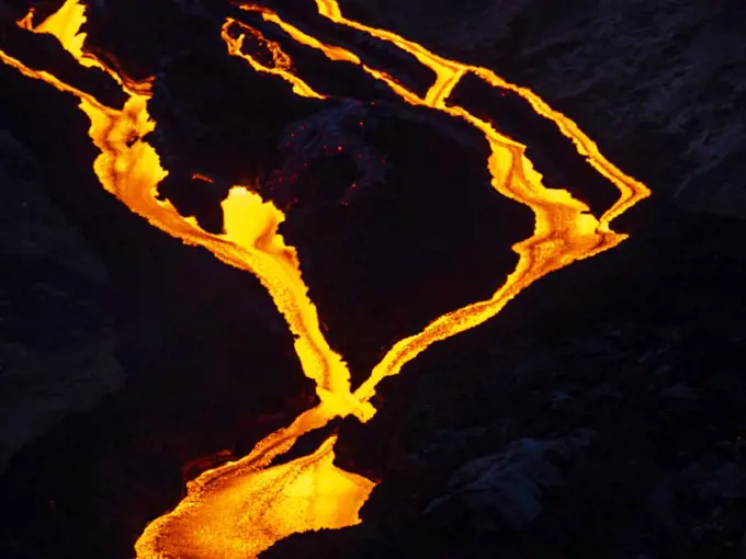 Glowing lava cascades from Fagradalsfjall volcanic eruption at Geldingadalir, Iceland