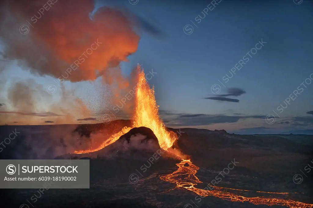 Reykjanes Peninsula, Iceland - May 9th 2021: Geldingadalir eruption at sunset with lava explosion