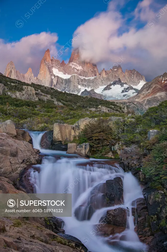 Waterfall with Mt. Fitz roy in the background, Los Glaciares National Park, El Chaltén, Patagonia, Argentina.