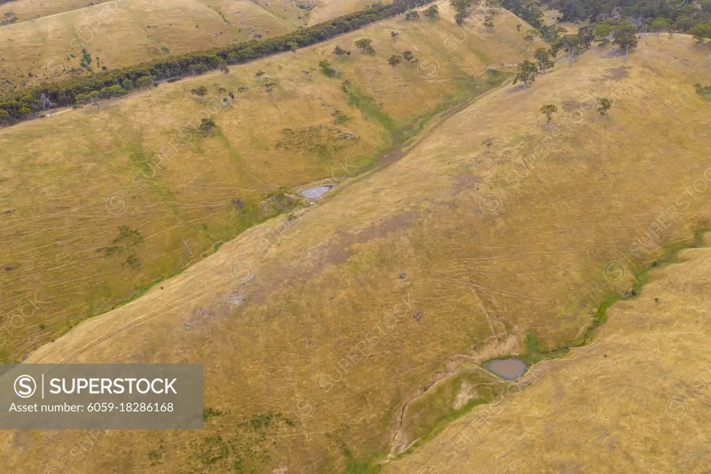Aerial view of rolling green hills in regional Australia