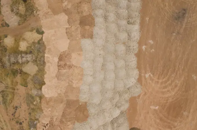 Aerial view of sand patterns in a dry river bed