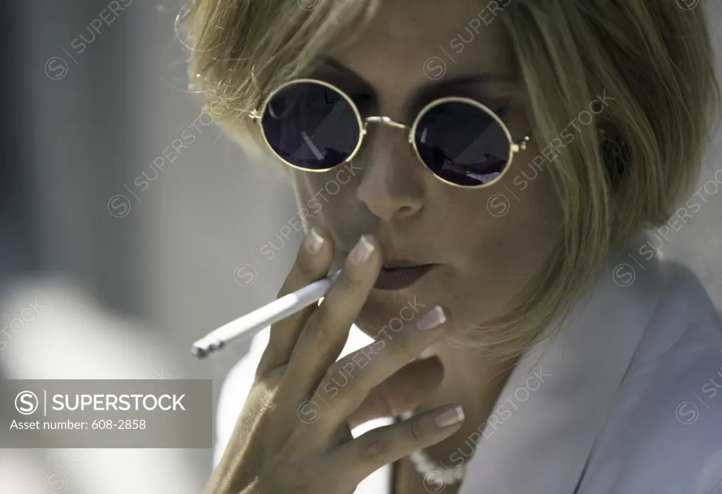 Young woman smoking a cigarette