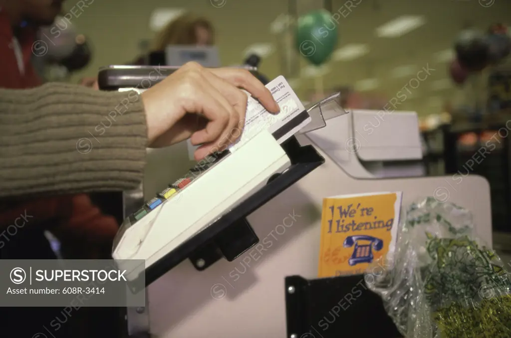 Person using a credit card machine