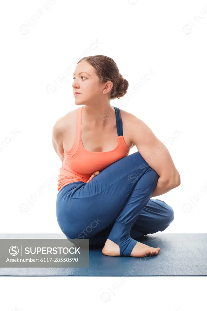 Woman doing Ashtanga Vinyasa Yoga stretching asana Marichyasana D - pose posture dedicated to sage Marichi on white background