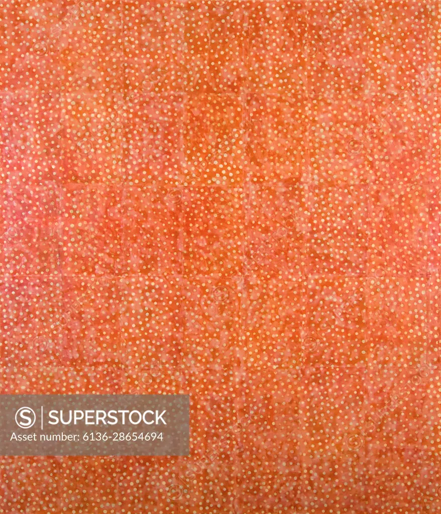 Small circles are built up with encaustic medium to create  tiny Pearl Drops” set against a background of orange collage material.