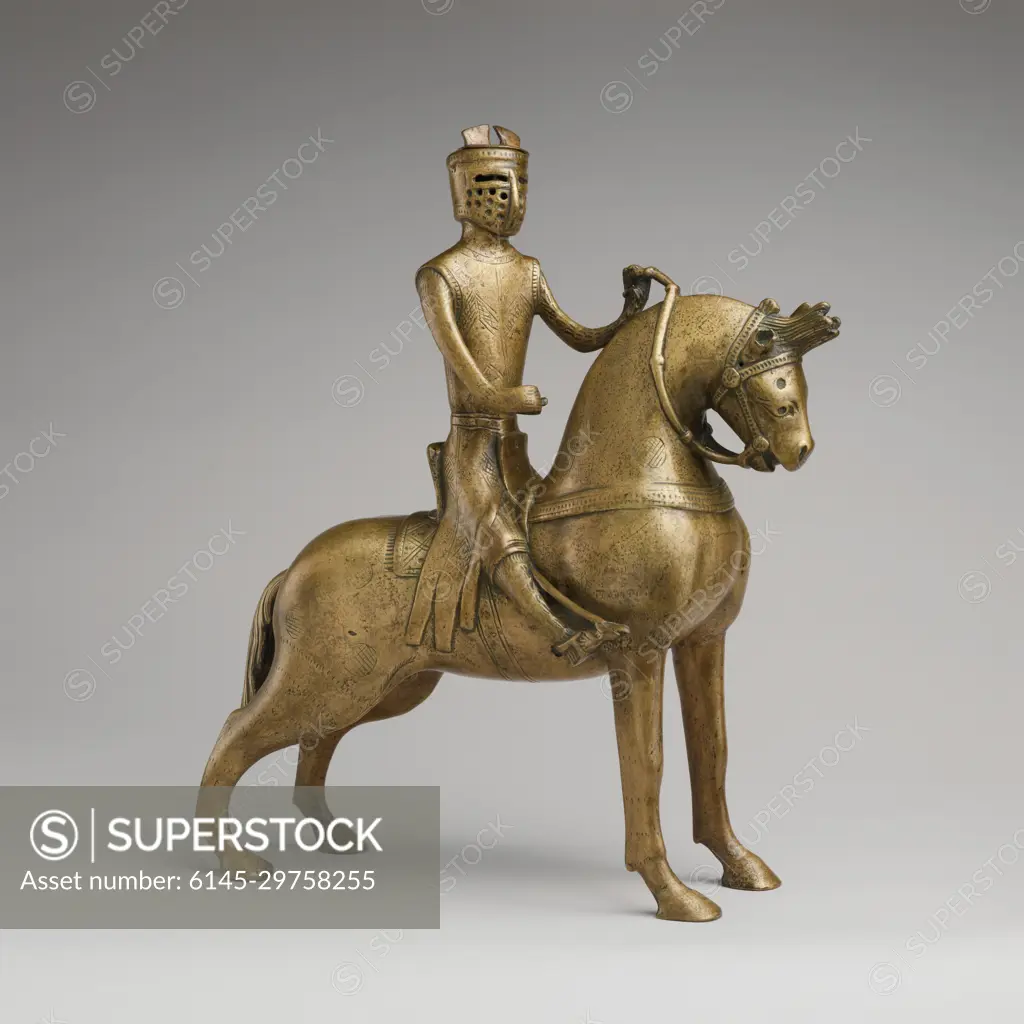 Aquamanile in the Form of a Mounted Knight ca. 1250 German Aquamanilia, from the Latin words meaning "water" and "hands," served to pour water over the hands of priests before celebrating Mass and of diners at table. This aquamanile, in the form of a horse and rider, exemplifies the courtly ideals of knighthood that pervaded Western medieval culture and influenced objects intended for daily use. It depicts a type of armor that disappeared toward the third quarter of the thirteenth century. Unfortunately, the shieldwhich probably displayed the arms of the ownerand the lance are no longer extant.. Aquamanile in the Form of a Mounted Knight. German. ca. 1250. Copper alloy. Made in probably Hildesheim, Lower Saxony, Germany. Metalwork-Copper alloy