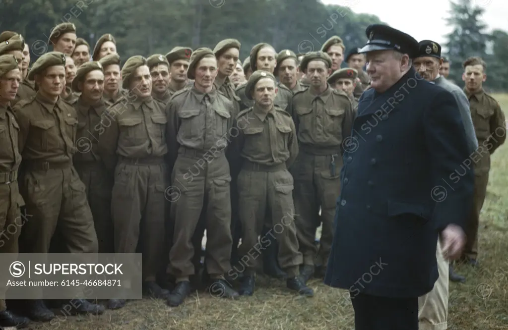 The Visit of the Prime Minister, Winston Churchill To Caen, Normandy, 22 July 1944 The Prime Minister, the Rt Hon Winston Churchill, MP, with men of the 50th Division who took part in the D-Day landings. Behind the Prime Minister is General Sir Bernard Montgomery.