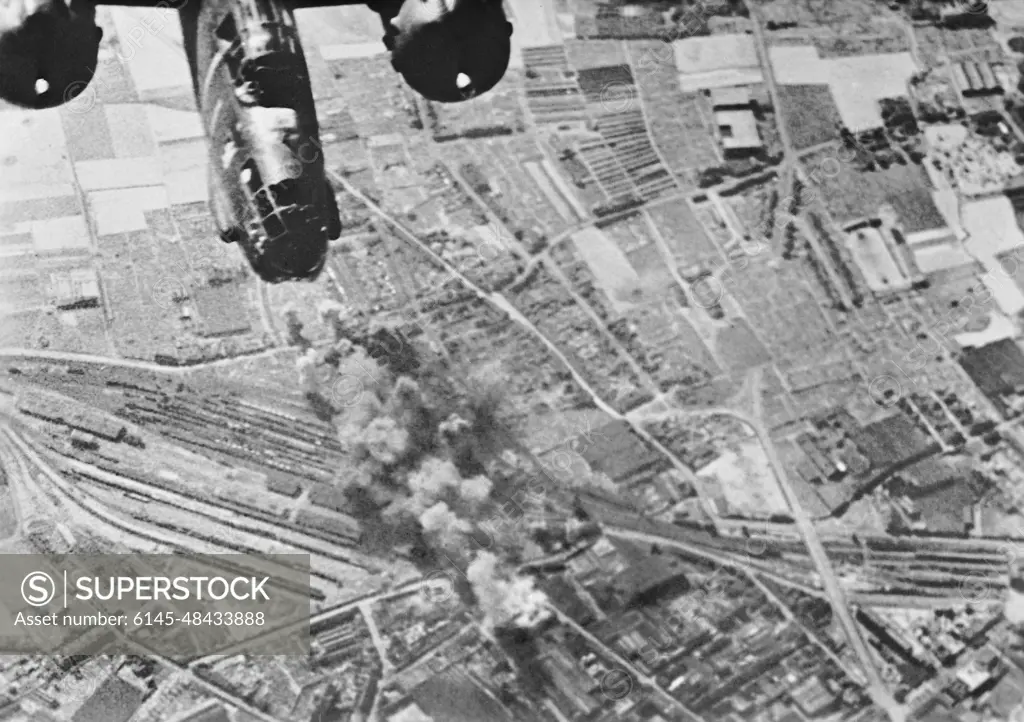 Preparations For Operation Overlord (the Normandy Landings)- D-day 6 June 1944 Daylight bombing raid on the railway yards at Tourcoing, France by aircraft of 2nd Tactical Air Force. Photograph taken by an RAF cameraman flying in one of the attacking Boston aircraft.