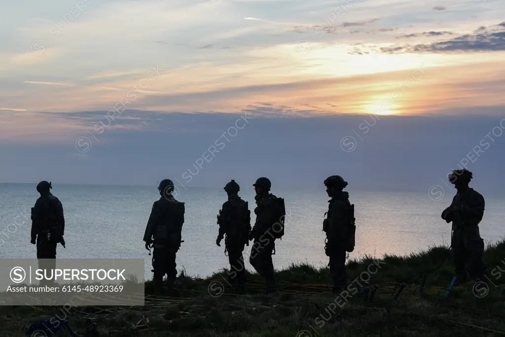 U.S. Soldiers with 75th Ranger Regiment scale the cliffs like Rangers did during Operation Overload 75 years ago at Omaha Beach, Pointe du Hoc, Normandy, France, June 5, 2019. More than 1,300 U.S. Service Members, partnered with 950 troops from across Europe and Canada, have converged in northwestern France to commemorate the 75th anniversary of Operation Overlord, the WWII Allied invasion of Normandy, commonly known as D-Day. Upwards of 80 ceremonies in 40 French communities in the region will take place between June 1-9, 2019, the apex being held June 6th at the American Cemetery at Colleville sur Mer.