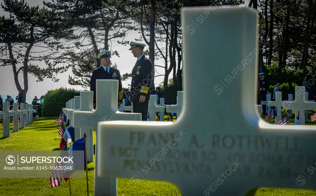 NORMANDY, France (June 6, 2019) Master Chief Petty Officer of the Navy (MCPON) Russell Smith, left, and Chief of Naval Operations (CNO) Adm. John Richardson visit the Normandy American Cemetery in Normandy, France, June 6, 2019. Today marks the 75th anniversary of the D-Day landings along the Normandy coast during World War II.