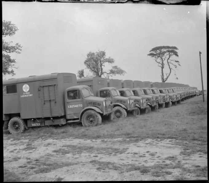 Invasion Build-up- Preparations For the D-day Landings, UK, 1944 A row of army X-ray laboratory trucks wait at an Ordnance Depot, somewhere in Britain, for collection and transportation to the Second Front.