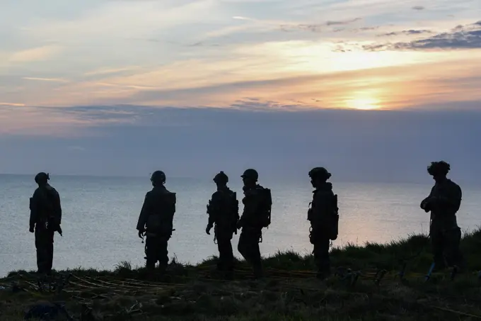 U.S. Soldiers with 75th Ranger Regiment scale the cliffs like Rangers did during Operation Overload 75 years ago at Omaha Beach, Pointe du Hoc, Normandy, France, June 5, 2019. More than 1,300 U.S. Service Members, partnered with 950 troops from across Europe and Canada, have converged in northwestern France to commemorate the 75th anniversary of Operation Overlord, the WWII Allied invasion of Normandy, commonly known as D-Day. Upwards of 80 ceremonies in 40 French communities in the region will take place between June 1-9, 2019, the apex being held June 6th at the American Cemetery at Colleville sur Mer.