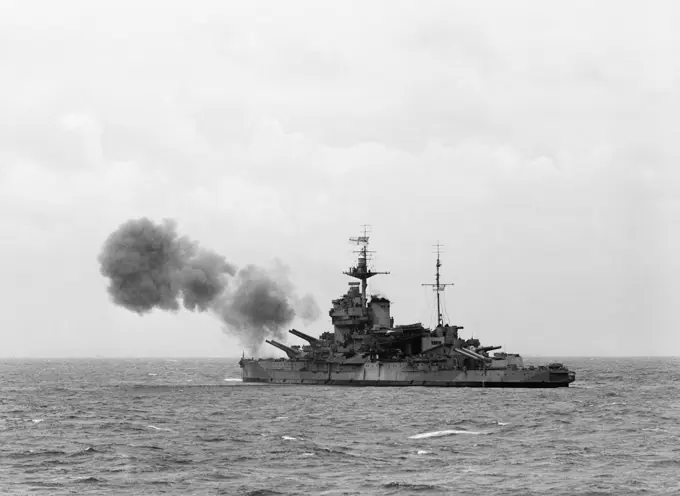D-day - British Forces during the Invasion of Normandy 6 June 1944 HMS WARSPITE, part of Bombarding Force 'D' off Le Havre, shelling German gun batteries in support of the landings on Sword area, 6 June 1944. The photo was taken from the frigate HMS HOLMES which formed part of the escort group.