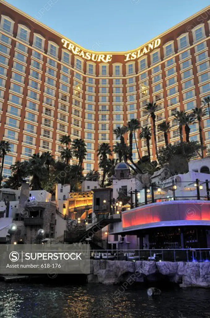 Hotel lit up at dusk, Treasure Island Hotel and Casino, Las Vegas, Nevada, USA