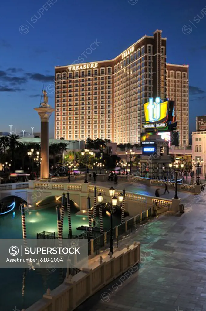 Hotel lit up at dusk, Treasure Island Hotel and Casino, Las Vegas, Nevada, USA