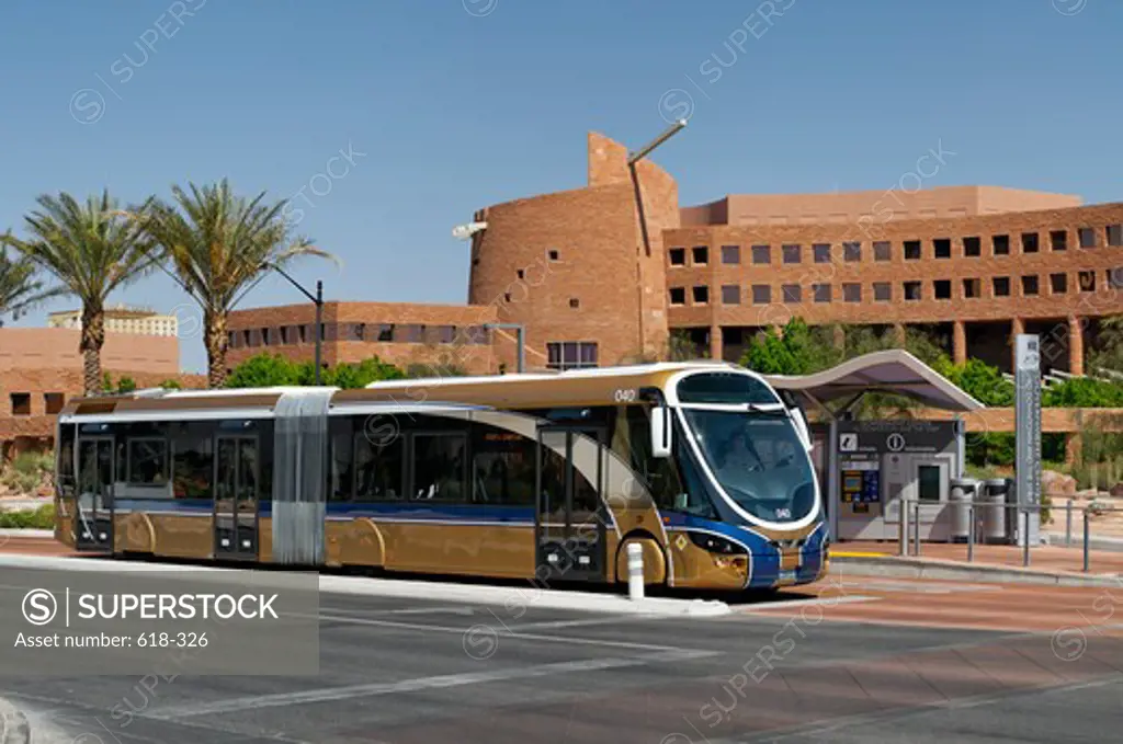 USA, Nevada, Las Vegas, Modern bus, part of Bus Rapid Transit system at stop with Clark Country Government buildings in background