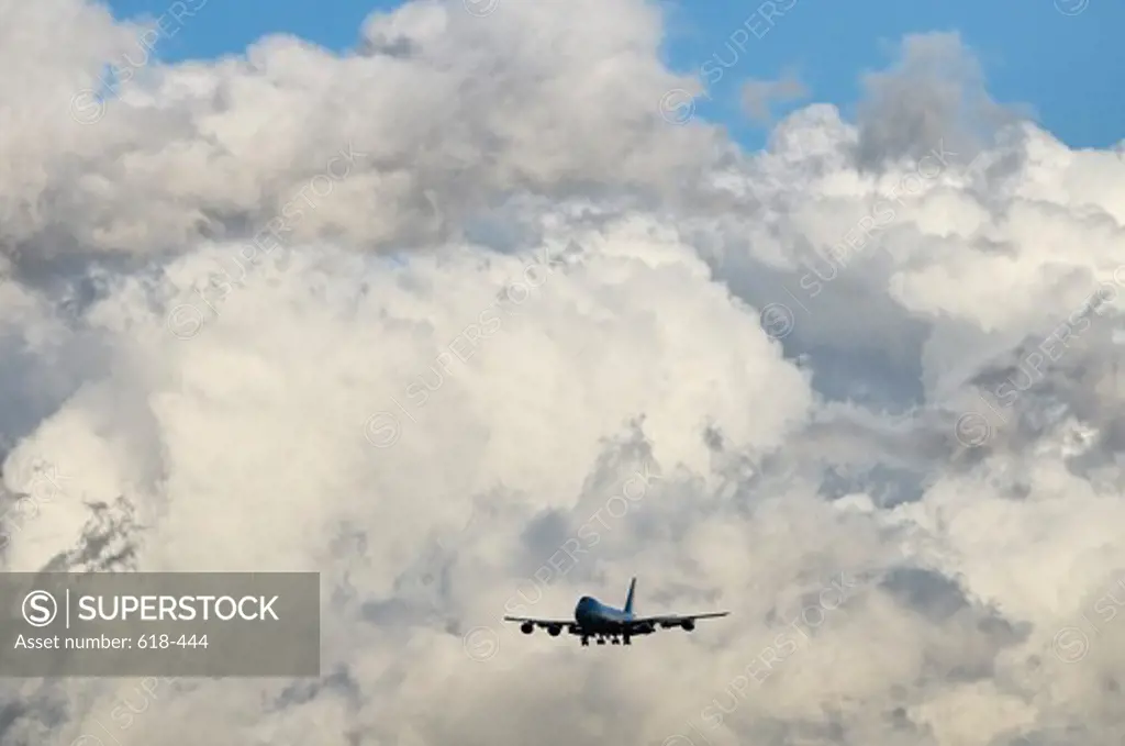 USA, California, Los Angeles, special version of Boeing 747-200 known as Boeing VC-25, dwarfed against billowing clouds while president is onboard