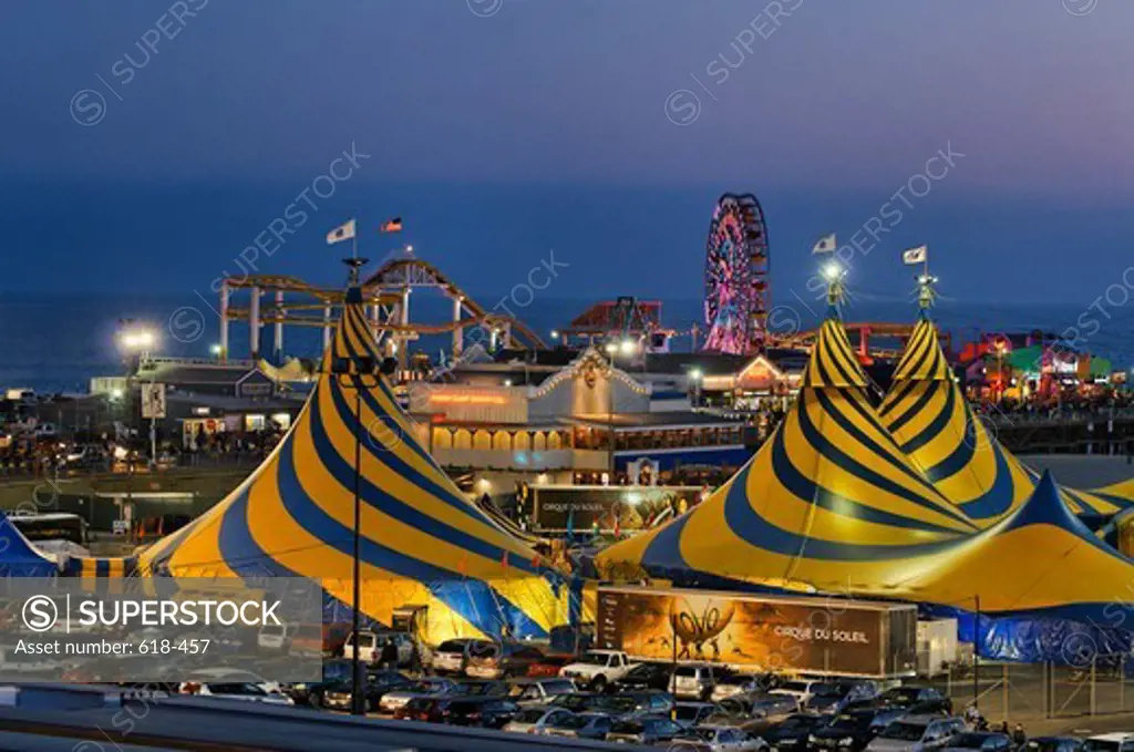 USA, California, Santa Monica, Striking blue and yellow tent tops of Cirque du Soleil, adorning Santa Monica Beach next to Santa Monica Pier, during their stay 2011 and 2012