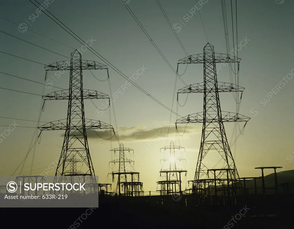 Silhouette of electricity pylons