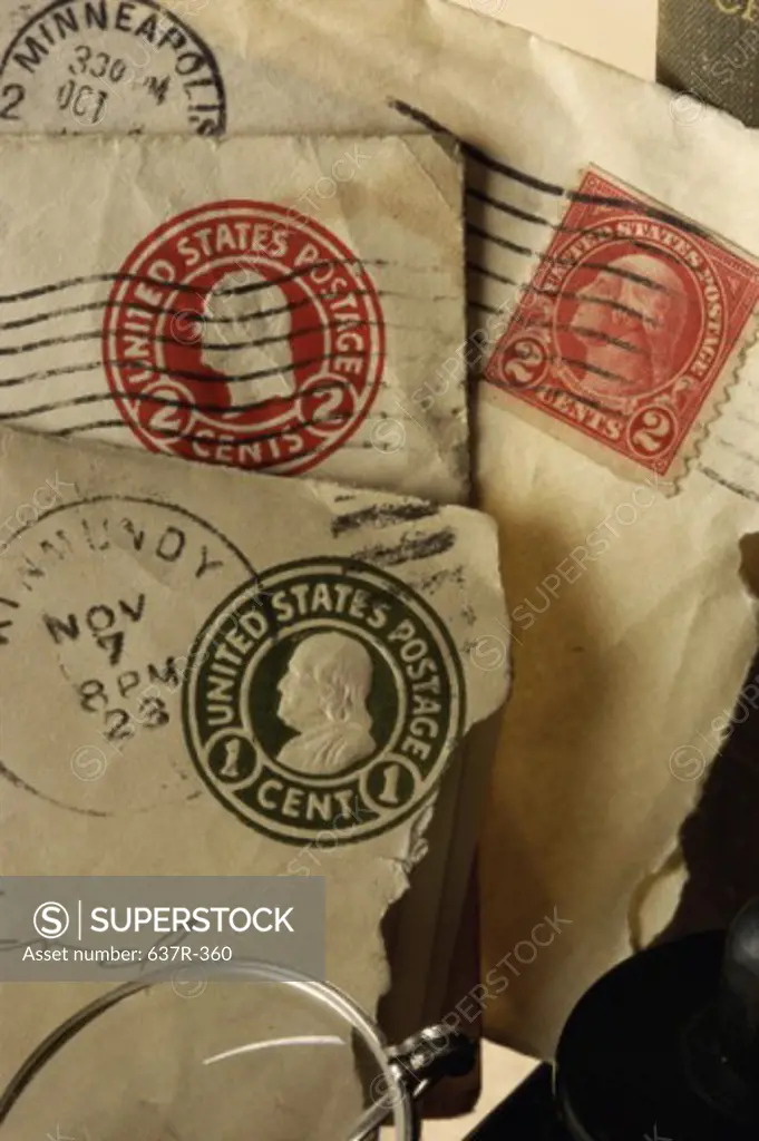 Close-up of antique envelopes and eyeglasses
