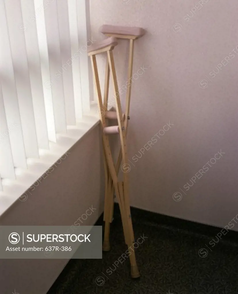 Crutches in the corner of a room
