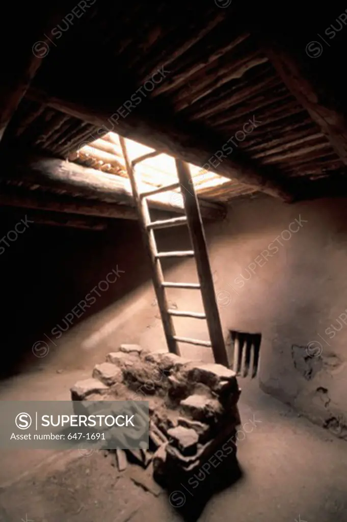 Ladder near a fireplace in a basement, Pecos National Historical Park, New Mexico, USA