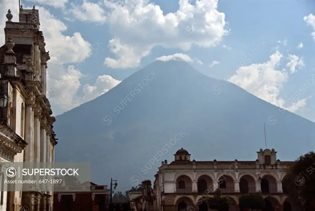 Buildings in a city with a volcanic mountain in the background, Agua Volcano, Antigua, Guatemala