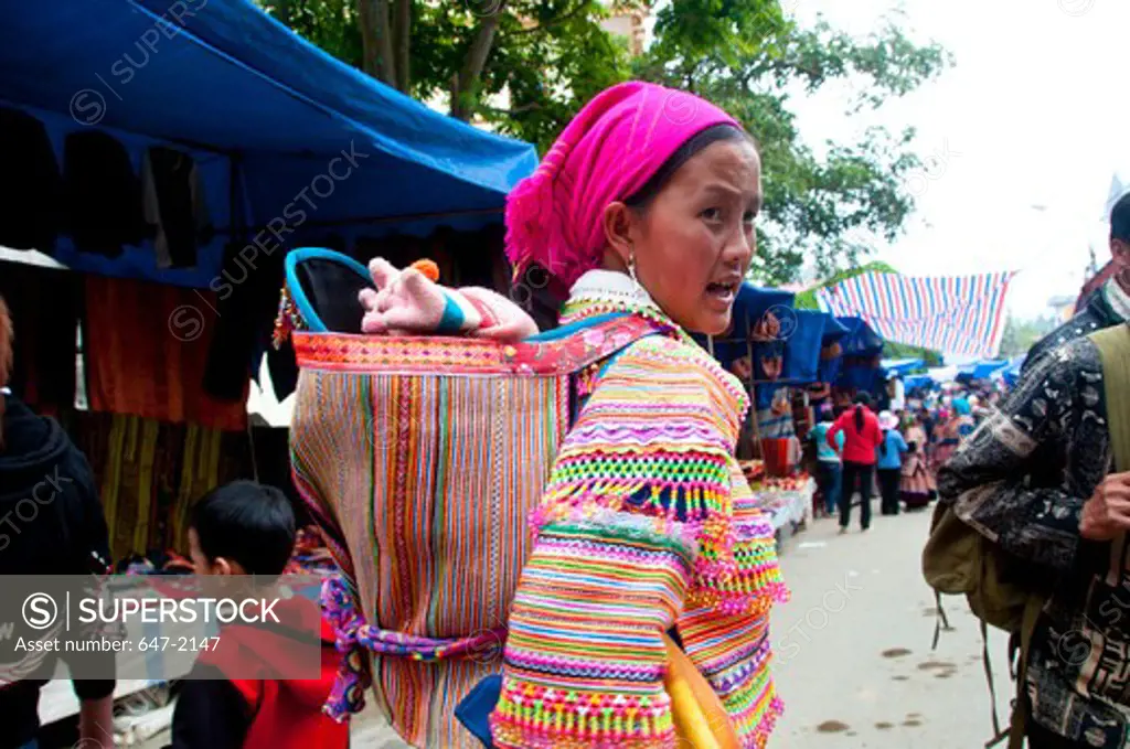 Mid adult woman in traditional clothing at a market, Bac Ha Market, Vietnam