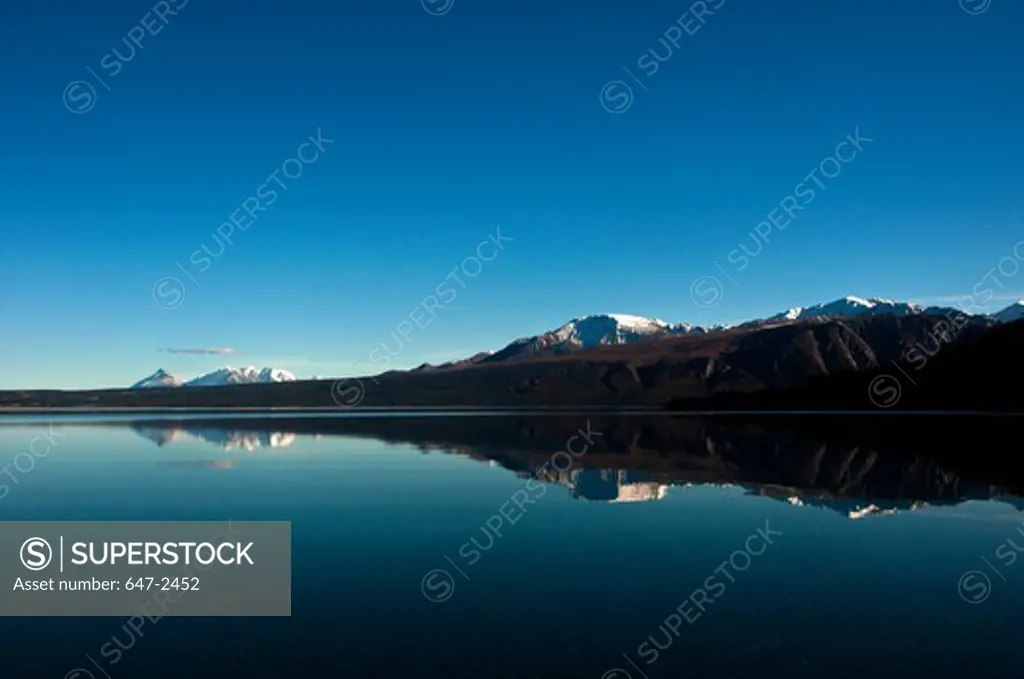 Reflection of Kluane National Park mountains in lake. Canada
