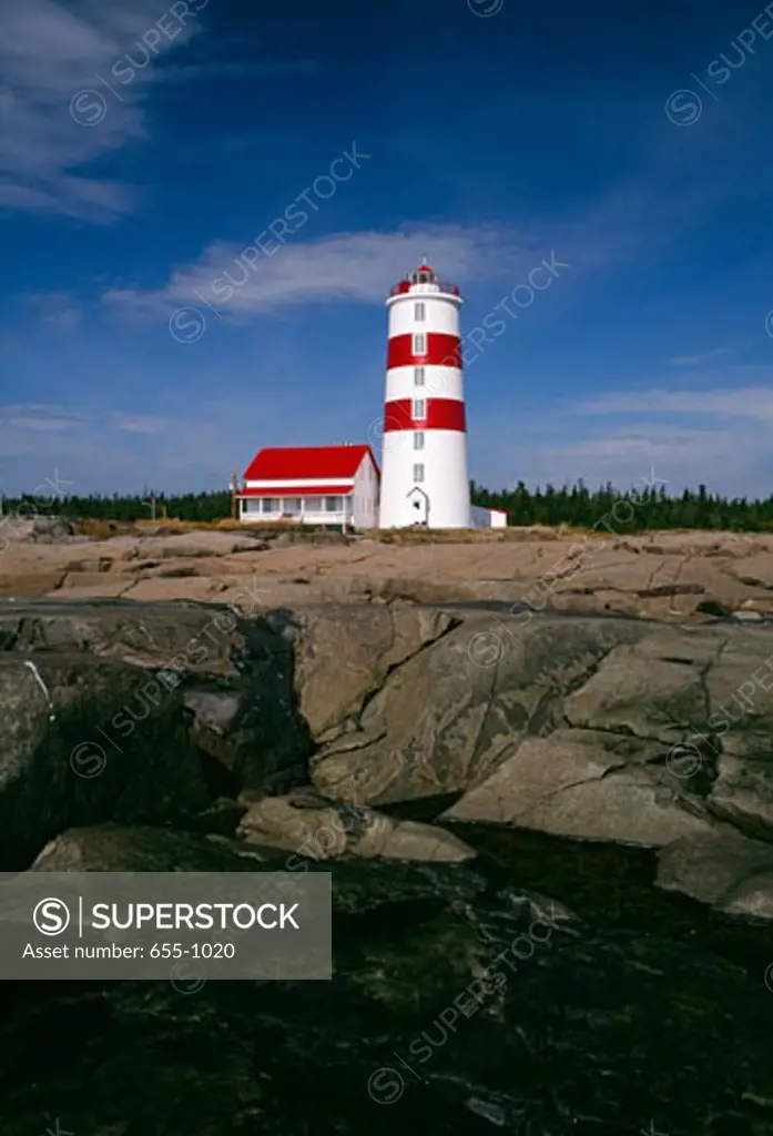 Lighthouse on the coast, Pointe-des-Monts Lighthouse, Pointe-des-Monts, Quebec, Canada