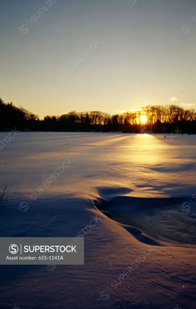 Frozen lake at sunset, Promised Land Lake, Promised Land State Park, Pennsylvania, USA
