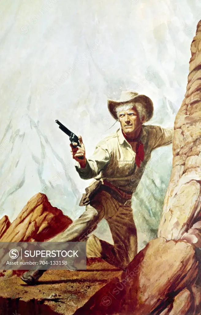 Cowboy with gun on top of rock