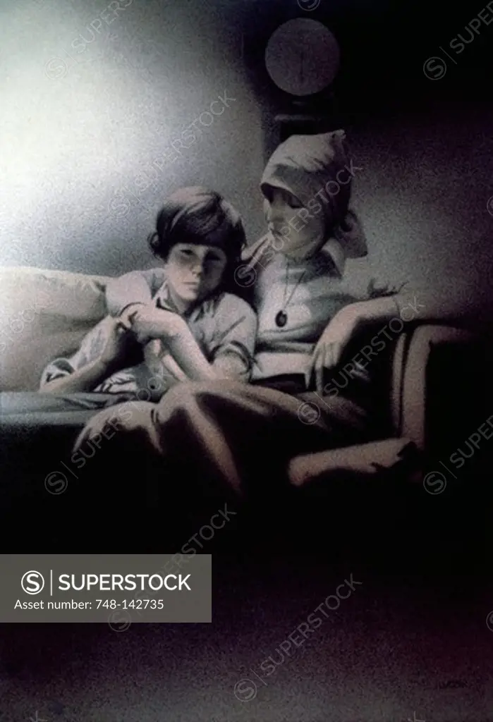Mother consoling boy on sofa