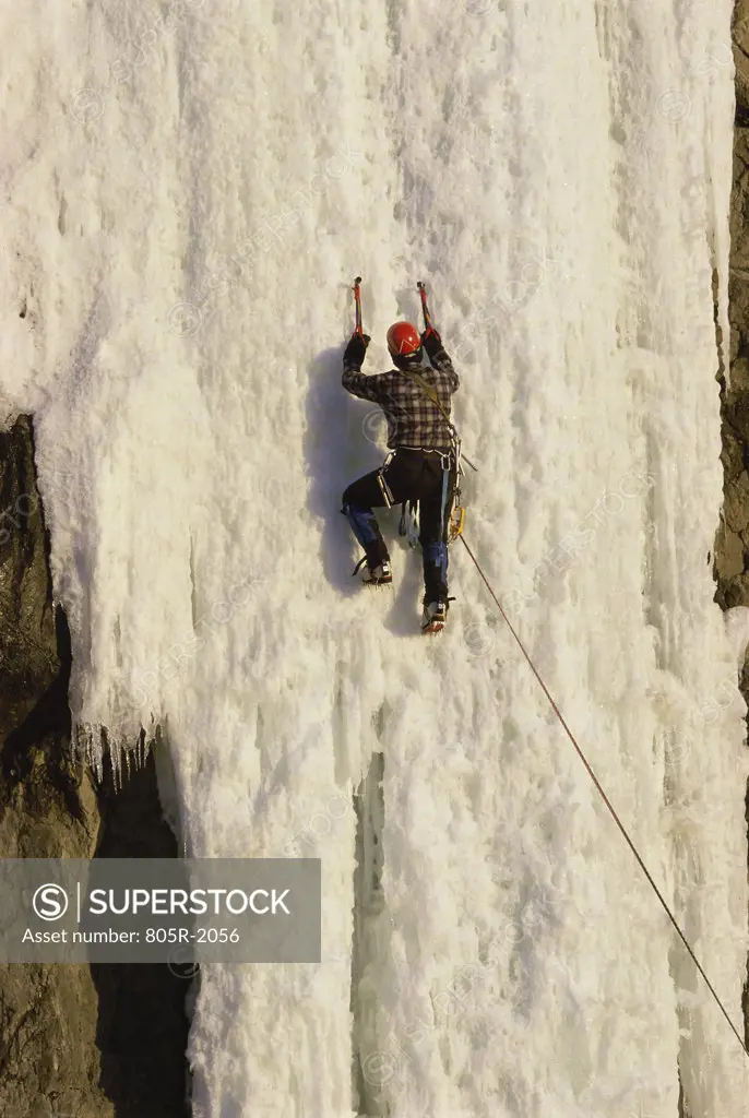 Person climbing a mountain, Alaska, USA